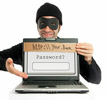 Person dressed as a stereotypical burglar holding a sign with a fake url and password field, symbolizing online phishing scams.